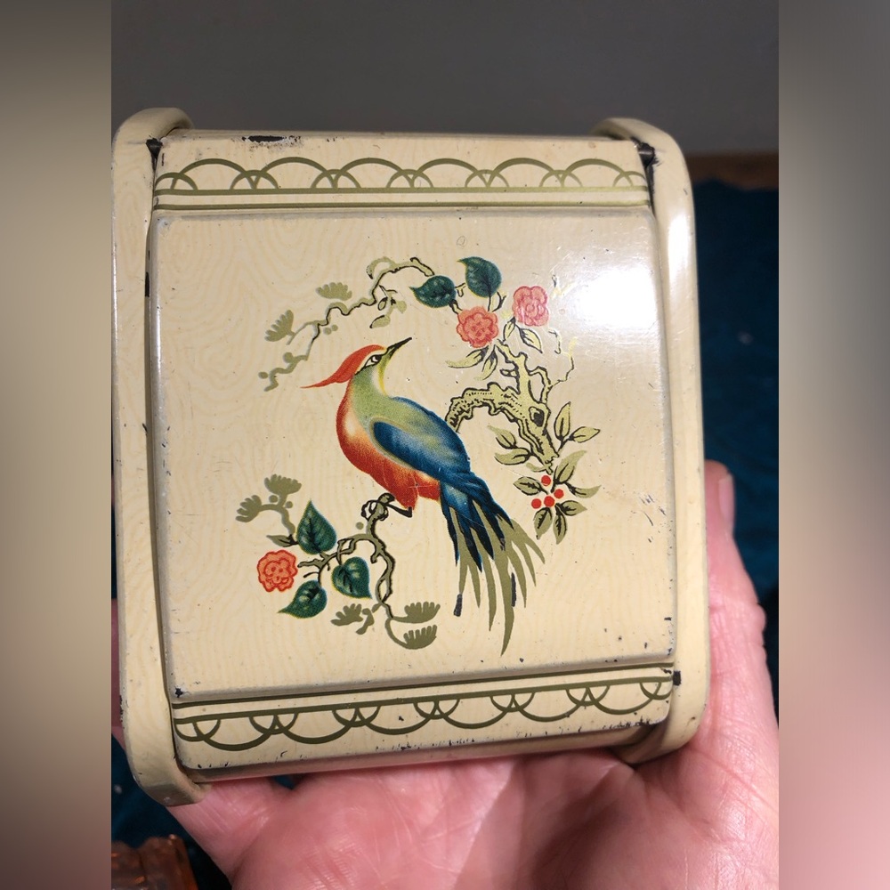 Antique metal cigarette box with bird